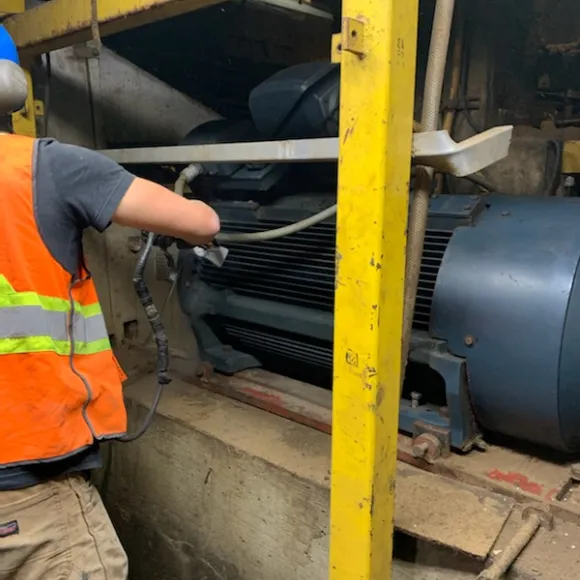 Using dry ice blasting to clean equipment at a pulp and paper mill