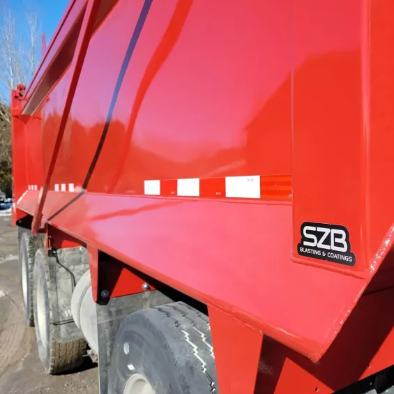 Red truck with SZB logo